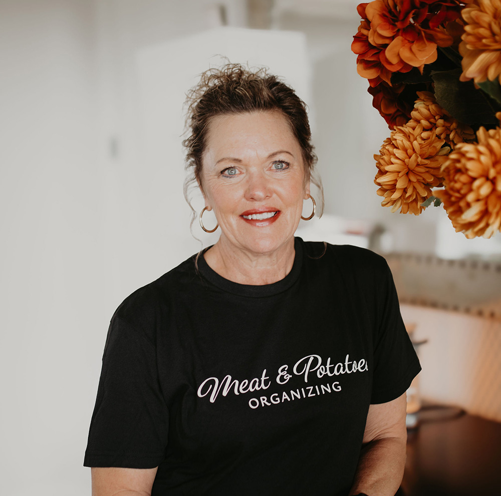 Brenda Safe, a professional organizer with expertise in decluttering and organizing solutions, standing in a tidy and well-organized space in Rochester. Dedicated to helping clients create functional and beautiful living spaces.